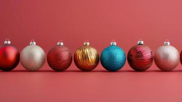 Colorful Christmas Ornaments Displayed on Red Background in Festive Arrangement photo