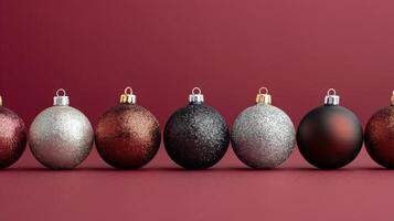 Colorful Christmas Ornaments Displayed on Red Background in Festive Arrangement photo