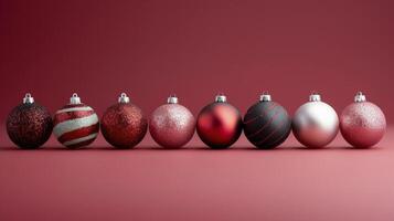 Colorful Christmas Ornaments Displayed on Red Background in Festive Arrangement photo