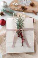 Christmas Gift Wrapped Elegantly in Front of Decorated Tree photo