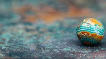 Colorful Marble Sphere on a Textured Surface in Soft Light photo