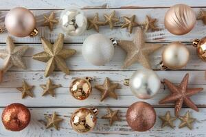Golden And Silver Christmas Ornaments Arranged On A Rustic Wood Background photo