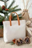 Stylish Rustic Bag With Pine and Dried Flowers on Cozy Fabric Background photo