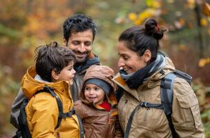 Family Enjoys Autumn Hike in Colorful Forest With Children Smiling and Laughing photo