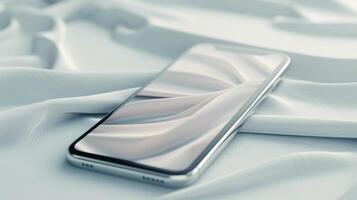 Mobile Phone Resting On Soft White Fabric In A Minimalist Setting photo