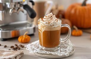 Pumpkin Spice Latte With Whipped Cream in Cozy Kitchen Setting During Autumn photo