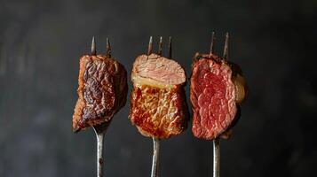 Three Steaks Grilling With Fork photo