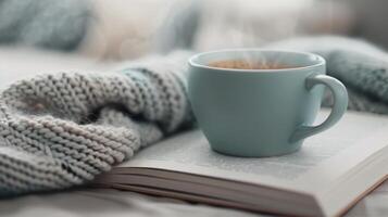 Cozy Coffee Moment With Book on a Soft Knit Blanket photo