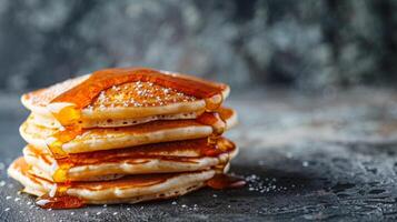 Stack of Pancakes Covered in Syrup photo