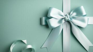 Elegant Mint Green Gift Box Tied With a Light Blue Ribbon photo