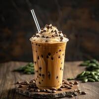 A Cup of Iced Coffee With Chocolate Chips on a Wooden Table photo