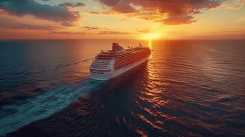 Cruise Ship Sailing in Ocean at Sunset photo