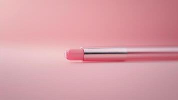 Pink Notebook and Pen on Soft Pink Surface in Minimalist Setting photo