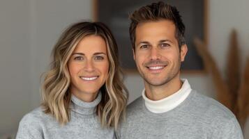 Young Couple Smiling Together in Cozy Indoor Setting During Daytime photo