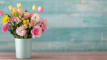 Colorful Flower Arrangement in Mint Green Vase Against Teal Wooden Background photo