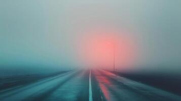 Mysterious Foggy Road With Distant Lights at Dawn in a Winter Landscape photo
