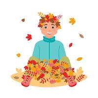 A happy boy wearing a wreath of leaves on his head is sitting in a pile with colorful leaves. vector