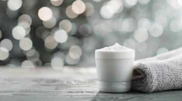 Moisturizing Cream on Wooden Table With Candlelight and Floral Accents in Soft Focus photo