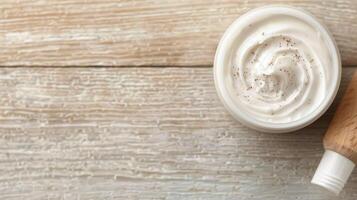 Moisturizing Cream on Wooden Table With Candlelight and Floral Accents in Soft Focus photo
