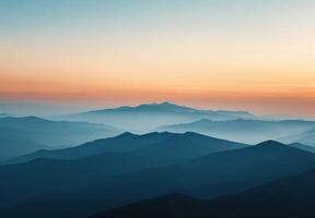 Breathtaking Sunrise Over Mountain Range With Soft Blue Haze in Early Morning photo