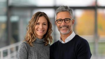 Young Couple Smiling Together in Cozy Indoor Setting During Daytime photo