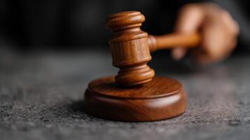 Judges Gavel Strikes Down Decision in Courtroom Setting photo