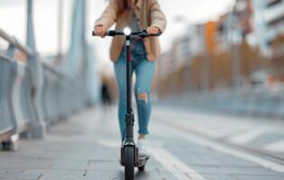 Woman Riding Electric Scooter on Urban Pathway During Daylight photo