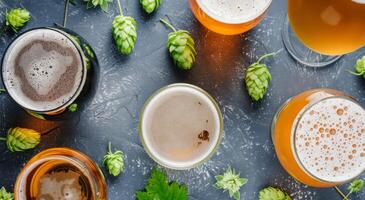 Craft Beers Arranged on a Dark Table With Fresh Hops photo