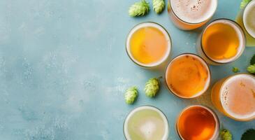 Assorted Craft Beers and Fresh Hops on Blue Surface During Afternoon Gathering photo