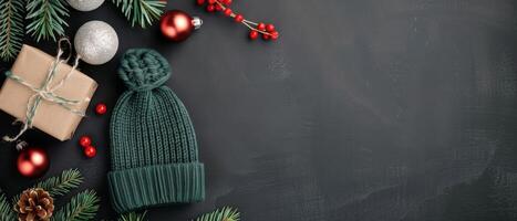 Green Knit Hat Surrounded by Christmas Ornaments and Snowflakes on Dark Background photo