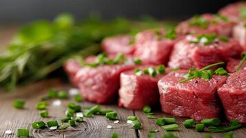 Fresh Cuts of Red Beef Chunks on Dark Wooden Table Ready for Cooking photo