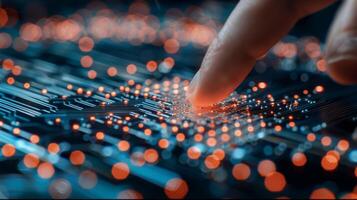 Finger Touching LED Circuit Board in High-Tech Setting photo