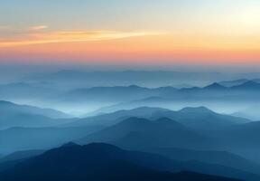 Serene Mountain Range at Dawn With Soft Mist and Gentle Hues photo