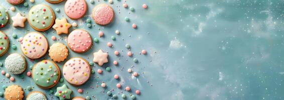 Assorted Cookies With Decorative Sprinkles on Light Blue Background photo