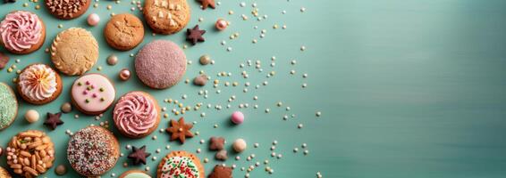 Assorted Cookies With Decorative Sprinkles on Light Blue Background photo