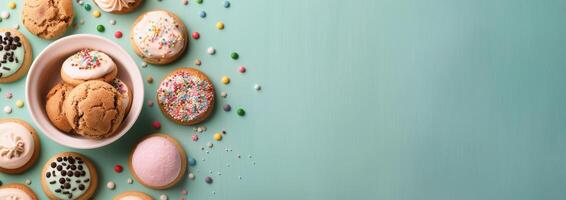 Assorted Cookies With Decorative Sprinkles on Light Blue Background photo