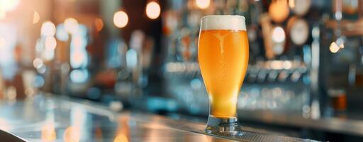 Golden Beer Glass Reflecting Warm Bar Lighting in Evening Hours photo