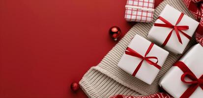 Festive Gift Boxes With Red Ribbons on Cozy Knit and Red Background photo