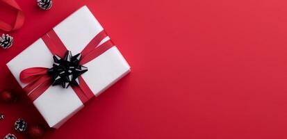 Holiday Gift Wrap Arrangement With Red Background and Seasonal Decorations photo
