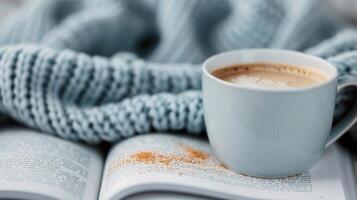 Cozy Autumn Moment With Hot Beverage, Knitted Blanket, and Leaves on a Table photo