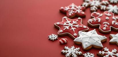 Festive Gingerbread Cookies Arranged on a Red Background for Holiday Celebrations photo