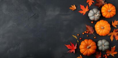 Autumn Arrangements of Pumpkins and Colorful Leaves on a Dark Table photo