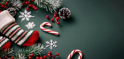 Christmas Stocking Surrounded by Decorations and Candy Canes on Dark Green Surface photo