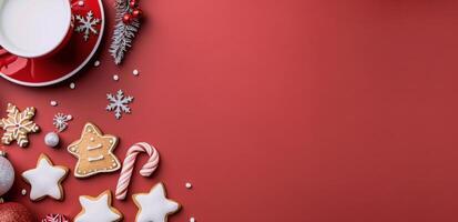 Festive Gingerbread Cookies and Decorations on Red Background During the Holiday Season photo