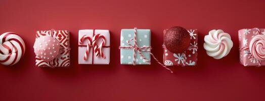 Festive Christmas Gifts and Ornaments Displayed on Red Background photo