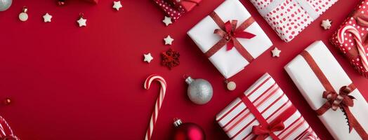 Festive Holiday Gifts Wrapped in Red and White Arranged on a Red Background photo