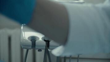 Doctor dentist at work plan hands and devices video