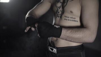The man winds with bandage fists before fight video