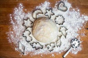 forms for squeezing the dough. dough on the table with dough tools. photo