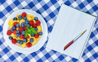 cornflakes, breakfast of cornflakes and berries photo